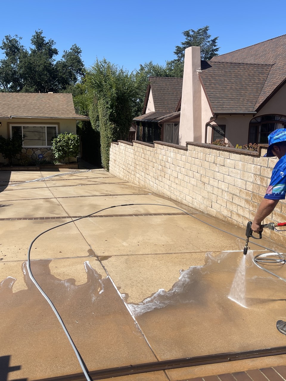 WashPro SFV technician pressure washing a residential driveway in Los Angeles